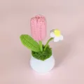 Handcrafted crochet tulip potted plant with pink flower and white daisy for home decor. - Fashion Pink