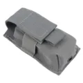 Durable grey nylon tactical flashlight pouch with MOLLE webbing system and bottom drainage hole. - Gray