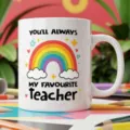 White ceramic coffee mug featuring a colourful rainbow design and teacher appreciation quote. - Style 19 / 350ml