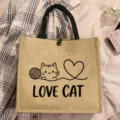 Natural jute tote bag with cute cat line art and English letter print for daily shopping. - Style 11
