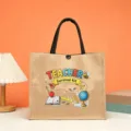 Close-up detail of the teacher theme jute tote bag with cute school icons and handle. - Style 7