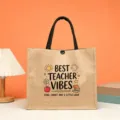 Detail view of a teacher themed jute tote bag, printed quote, durable linen shopping handbag. - BEST TEACHER VIBES