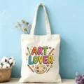 Vue détaillée du sac cabas en toile Art Lover avec lettrage coloré et motifs artistiques vibrants. - Thème Art (11)