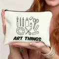 White canvas pouch with art supply line art and text for daily makeup and stationery storage. - Art Painting Illustration Style (13)