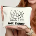Canvas makeup pouch detail, showing cute nail tools line art print and white zipper design. - Nail Tools Illustration Style (6)