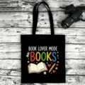 Black canvas tote bag with book lover print, durable casual shoulder bag for daily use. - Style 03