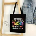 Black canvas tote bag for teachers with colorful letter print, large capacity casual shoulder bag. - Teacher Style 03