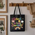 Canvas tote bag hanging on wooden wall hook, detailed view of rainbow teacher school design - Style 4 / Black