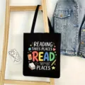 Detailed view of black canvas tote bag with reading theme text print, lifestyle background. - Reading Style 02