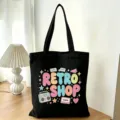 Borsa tote in tela nera con stampa retro, borsa a spalla casual di grande capacità per uso quotidiano. - Cassetta Radio Retrò (01)