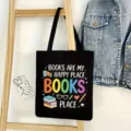 Black canvas tote bag detail, featuring colorful book theme print, casual aesthetic lifestyle view. - Books Style 01