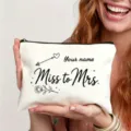 Close-up detail showing custom canvas makeup bag with black zipper, elegant line art and text. - Rose Heart Illustration Style (Art No 7.16)