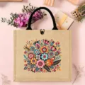 Close-up detail of the Nordic folk style jute tote bag featuring colorful floral print. - Style 9 (Colorful Floral Animal)