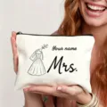 Detail shot of a white canvas cosmetic bag featuring custom wedding dress line art and text. - Mrs Wedding Dress Style (Art No 7.16)