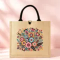 Close-up detail of the vintage folk floral print on the natural jute tote bag fabric. - Style 5 (Retro Flower)