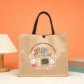 Detail view of teacher theme burlap tote bag with cute rabbit print and sturdy handles. - Style 6