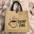 Detail view of jute tote bag featuring cute coffee cup print and teacher fuel wording. - Style 6