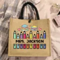 Detail view of custom teacher jute tote bag with cute colored pencil and book graphic print. - Colored Pencils and Books Style (4)