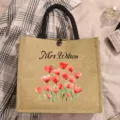 Close-up detail of custom canvas jute tote bag with personalized name and watercolor hearts print. - Heart Floral Print (5)
