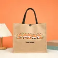 Detailed close-up view of custom jute tote bag featuring cute cartoon foxes and sturdy handle. - Style 5