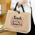 Close-up of the natural jute tote bag featuring cute teacher theme graphic and handles. - Style 3