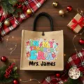 Personalized teacher jute tote bag with festive Christmas background and custom name print. - Style 16