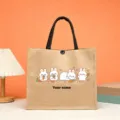 Close-up detail of cute rabbit and carrot pattern printed on the natural jute tote bag. - Style 4