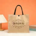 Close-up of the vintage French style jute tote bag with black handles and Bonjour print. - Bonjour Retro Style (15)