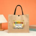 Burlap tote bag for teachers with black handles and motivational English print design. - Teachers Change Lives Style (12)