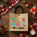 Custom jute tote bag detail featuring personalized teacher themed graphic and black handles. - Style 19