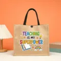 Detail shot showing the teacher theme graphic print on the durable jute tote bag surface. - Teaching Is My Superpower Style (5)