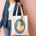 Cute cartoon yellow duck canvas tote bag with blue scalloped frame print for daily use. - 04