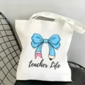 Canvas tote bag with cute teacher life graphic, stylish and practical for daily use and travel. - Blue Bowknot Style 3 / 35x40cm