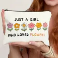 Close-up detail of the cute canvas zipper pouch featuring floral graphic and motivational quote. - Flower Style (011)