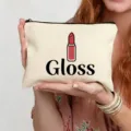 Vue détaillée d'une trousse de maquillage en toile blanche avec joli motif et texte. - Style Gloss (6)
