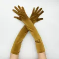 Detailed view of elegant long velvet opera gloves in gold, perfect for retro 1920s evening party. - One Size / Camel