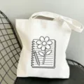 Lässige weiße Stofftasche aus Segeltuch mit Blumen Notizbuch Motiv, große Umhängetasche. - 35x40cm / Notizbuch Blumen und Bleistift Muster