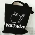 Black canvas tote bag with teacher graphic, large capacity minimalist shoulder shopping bag. - Apple and Pencil Pattern (2) / 35x40cm / Black