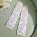 White satin lace long bridal gloves with floral embroidery and bows for elegant wedding events. - One Size / White