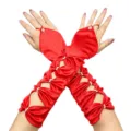 Close-up detail of red satin hollow-out fingerless wedding gloves with pearl beads. - One Size / Bright Red