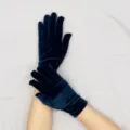Close-up detail of dark blue velvet gloves showing soft texture and fine stitching work. - Navy Blue