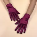 Wine red short stretch satin gloves, smooth fabric, elegant prom performance wear. - Dark Red