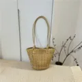 Woven bucket bag detail showing intricate lattice pattern and knotted handles in beige. - Dark Yellow