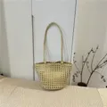 Beige woven bucket bag for women, large capacity stylish shoulder handbag for summer commute. - Light Yellow