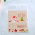 Sacchetto di imballaggio per biscotti di Natale autoadesivo con dettaglio di Babbo Natale. - Babbo Natale e Renna / Confezione da 100