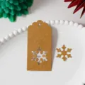 Kraft paper Christmas gift tag with snowflake cutout design, DIY holiday hanging label. - Kraft Christmas Snowflake / Pack of 100