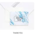 Biglietto di auguri in marmo blu con busta e testo di ringraziamento per feste ed eventi. - Grazie