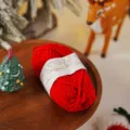 Red yarn string for DIY handmade decoration and holiday gift wrapping package detail view. - Red