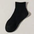 Solid black mid-calf cotton socks for men and women, comfortable daily sports socks. - One Size / Black Mid-Tube