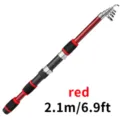 Close-up detail of the red telescopic fishing rod handle and sections, showing textured grip. - 2.1M Single Rod / Red